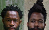 Nigerian twin filmmakers Arie and Chuko Esiri posing together.